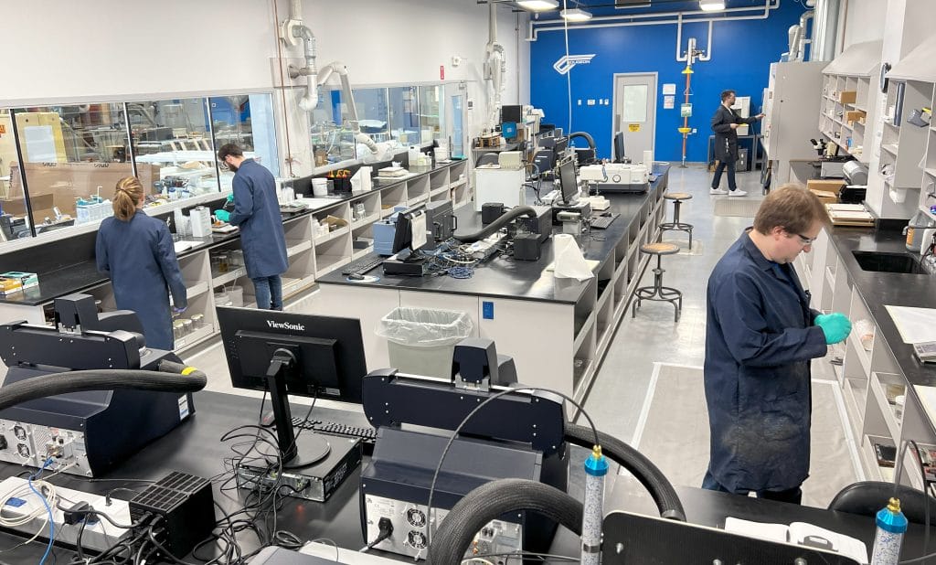 Employees working in a chemistry lab