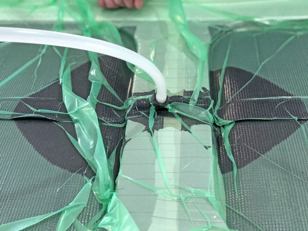 Bottom of a car covered in carbon fibre.