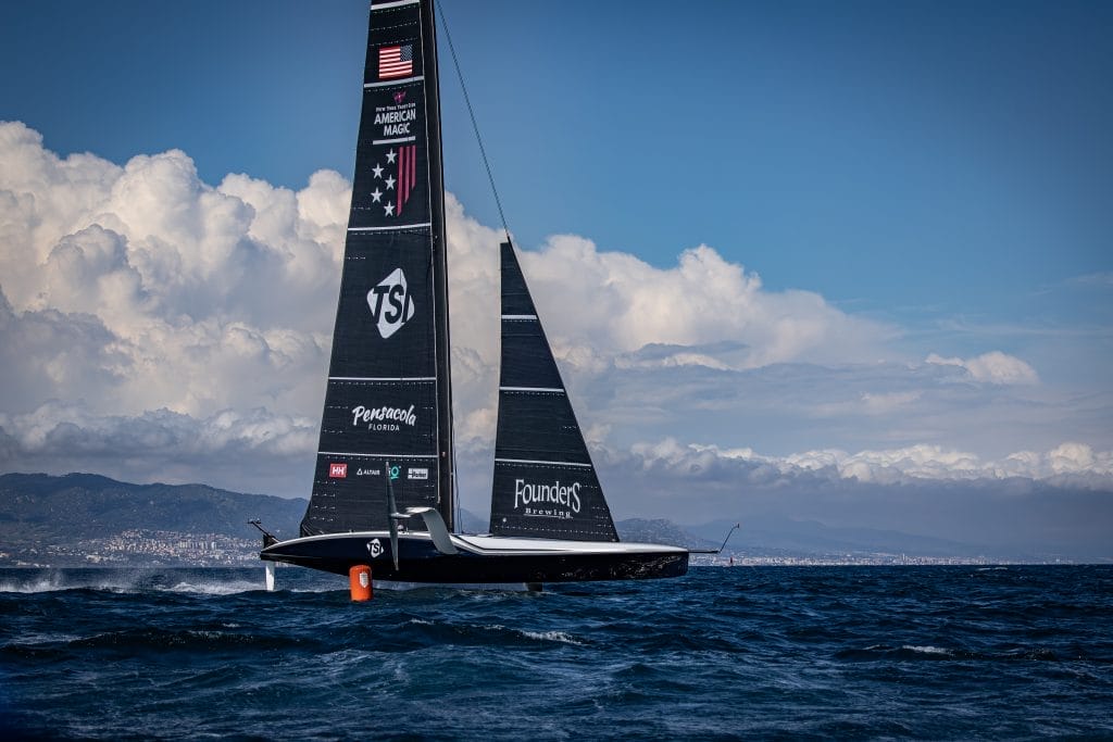 Black Racing boat - G AM PATRIOT BCN Cloud Waves AIL