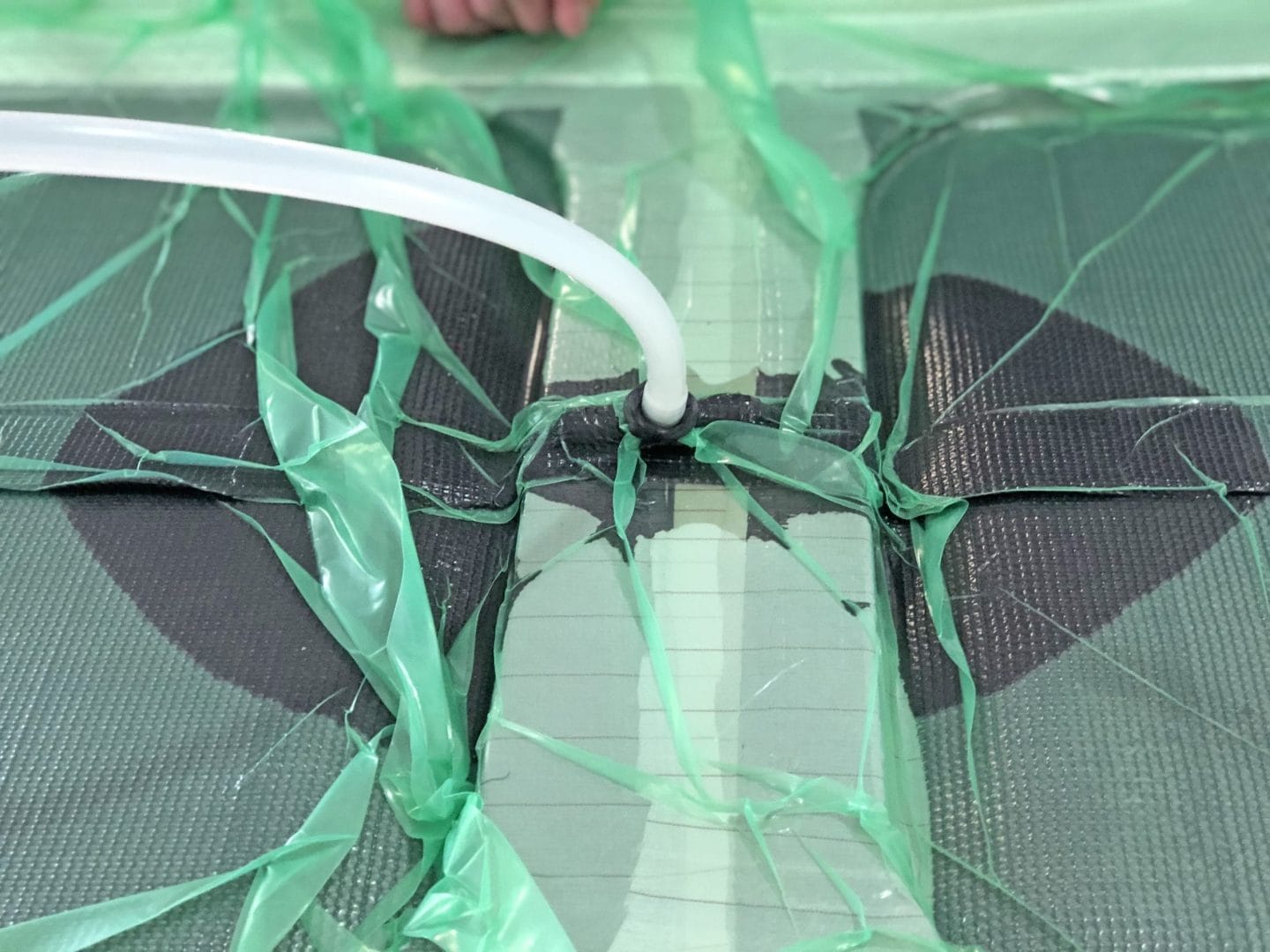 Bottom of a car covered in carbon fibre.